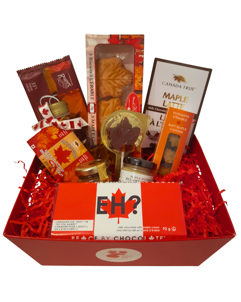 A small sized maple treats gift basket, featuring delicious made in Canada maple food products such as chocolates, cookies, butter, syrup, and candies.