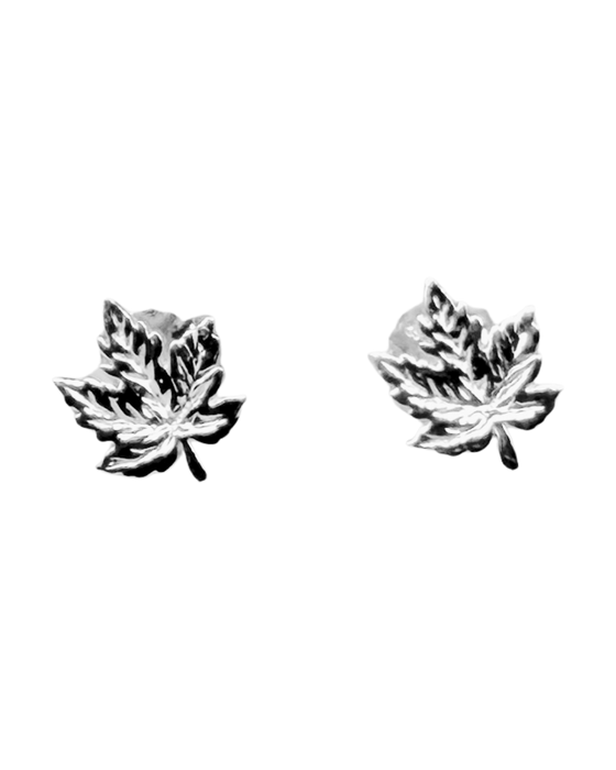 Two small sterling silver maple leaf earrings sit on a black background.  The earring backs cannot be seen.