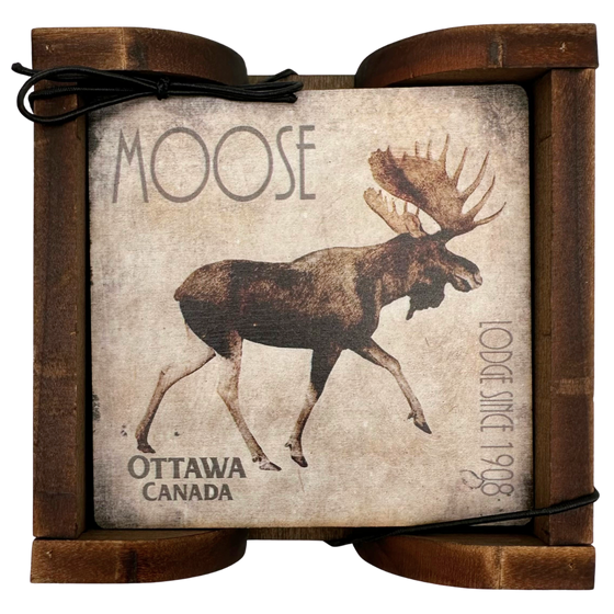 A square wooden coaster displayed in an attractive wooden holder. The coaster shows a moose walking against a distressed wood background. The coasters says "Moose" in the top left, "Ottawa Canada" in the bottom left, and "Lodge since 1908" along the right side.