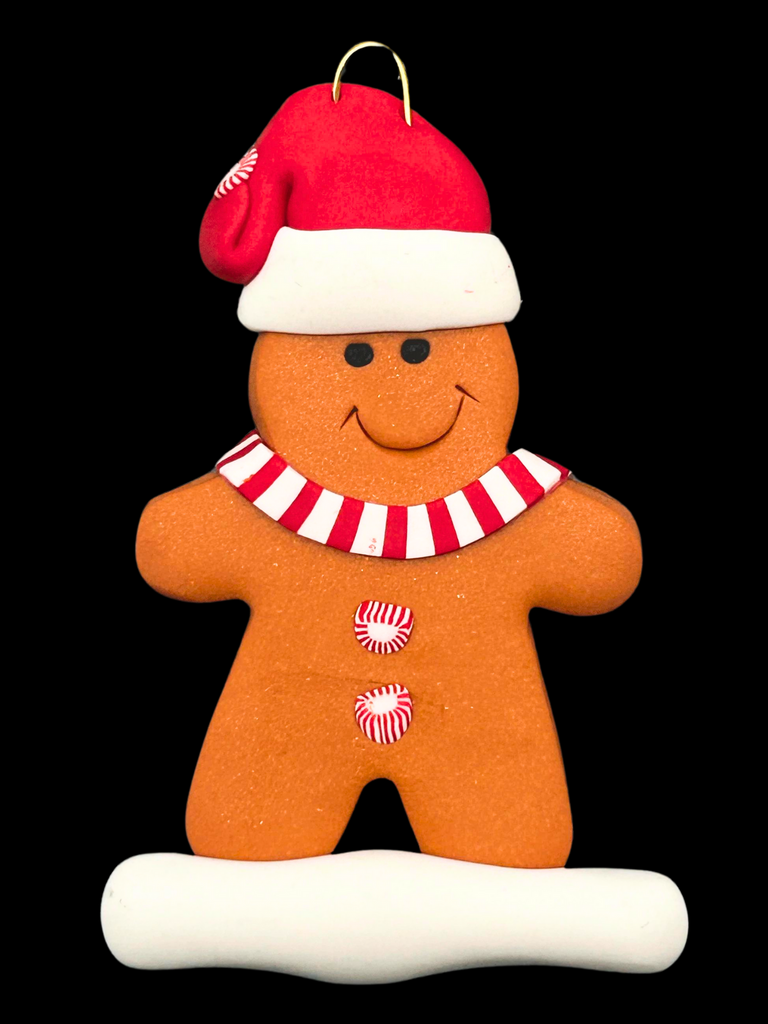 A smiling gingerbread man wearing a red Santa hat, red and white mints as buttons, and a red and white striped scarf.