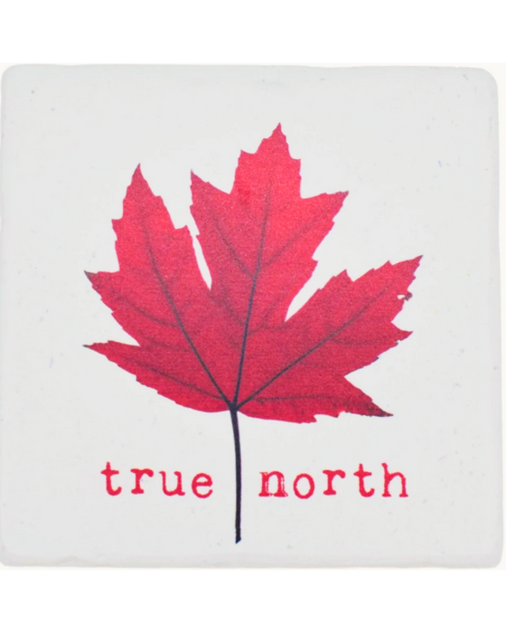 Iconic Canadian red maple leaf stands in the center of the white marble coaster with the words "True North" printed below.