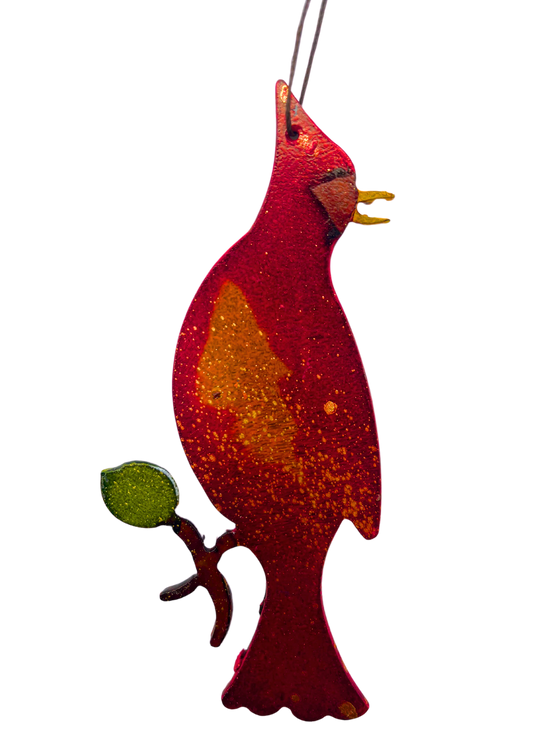 A cawing cardinal sitting on a branch. The cardinal and branch are handpainted with bright and vivid colours.