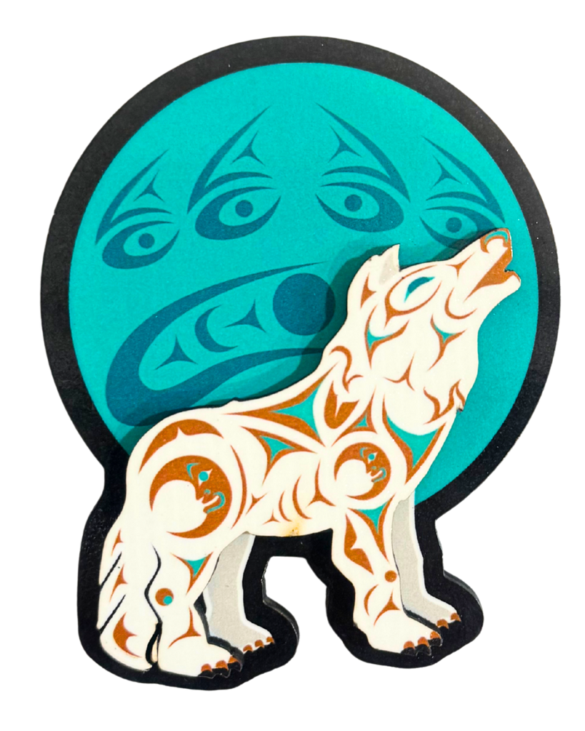 Magnet of a wolf with indigenous patterns against a blue moon.