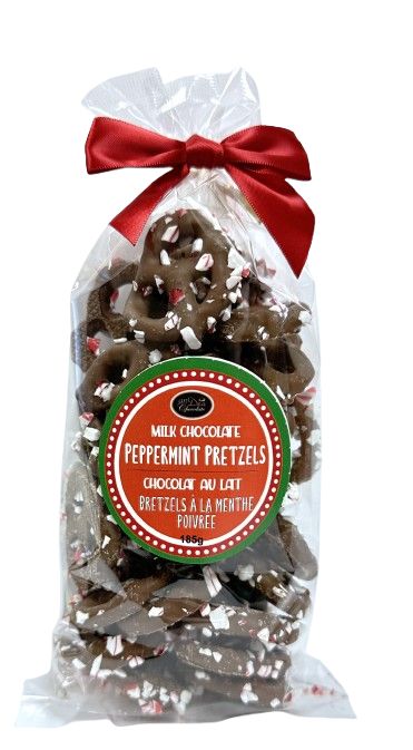 Packaged chocolate pretzels with a red bow and label.