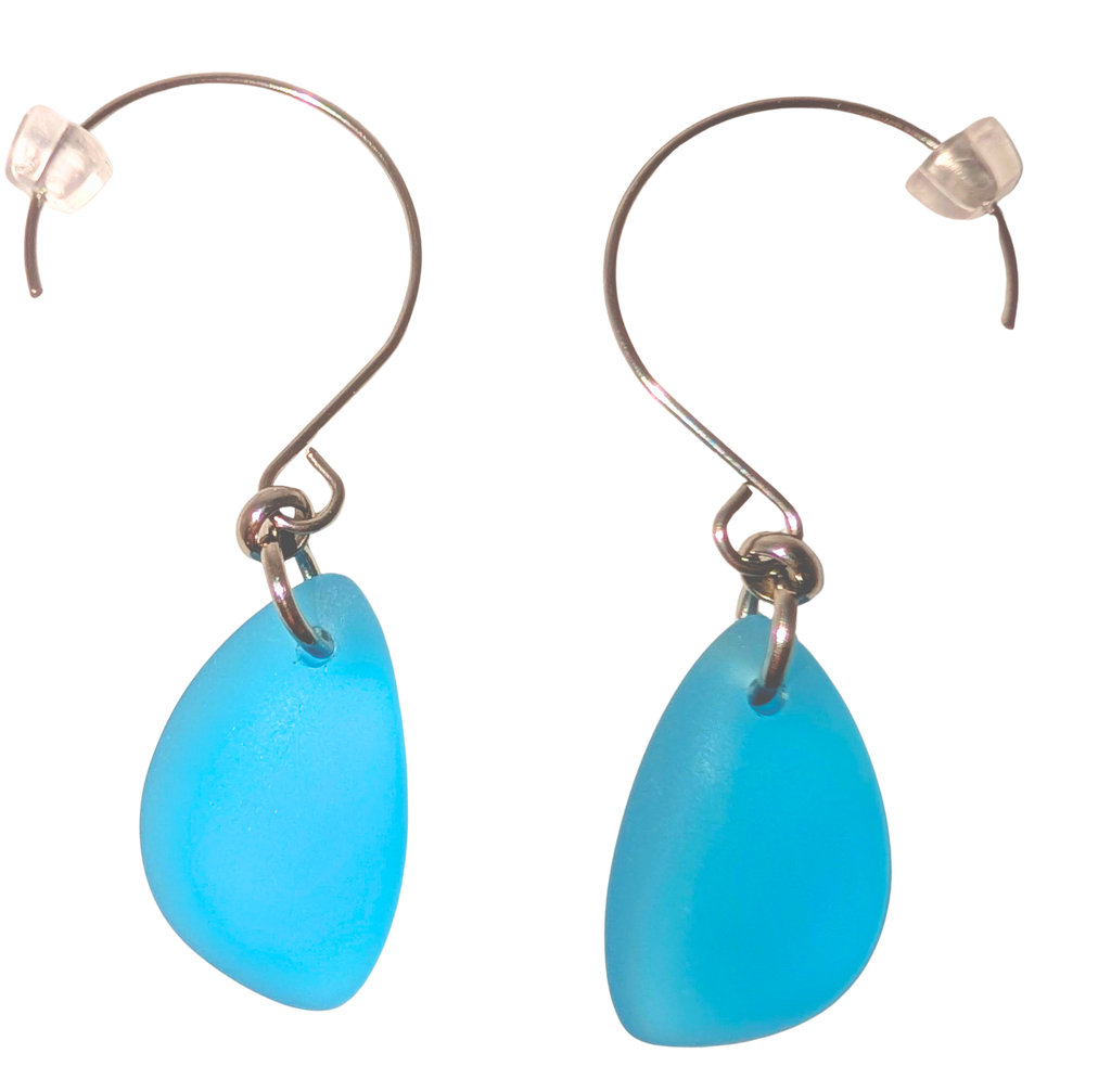 Turquoise teardrop sea glass earrings with silver hooks.