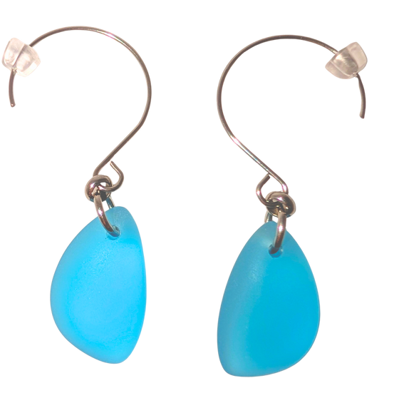 Turquoise teardrop sea glass earrings with silver hooks.