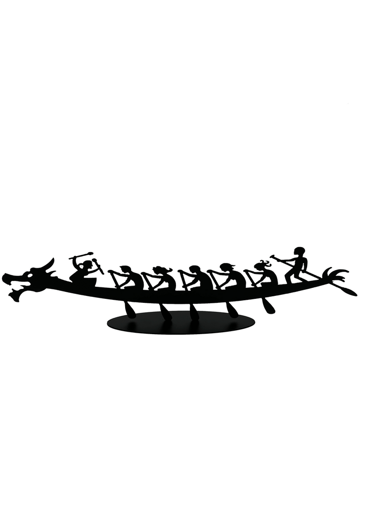 A matte black silhouette of a dragonboat, complete with team, paddles hard against a sturdy black steel base.