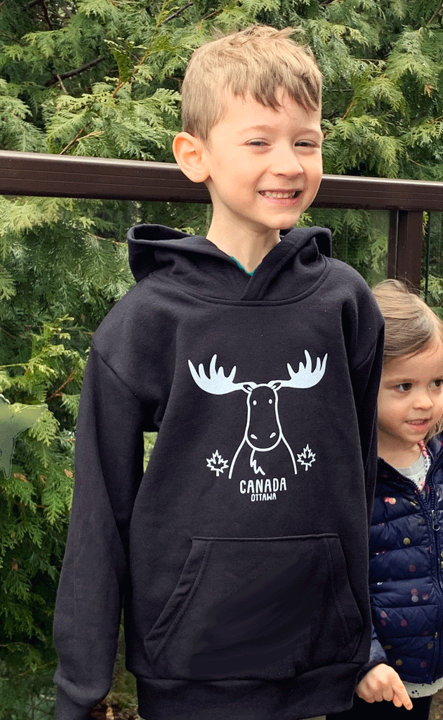 A black hoodie with a White moose and two white maple leaves on the chest, with Canada, Ottawa written in white underneath.