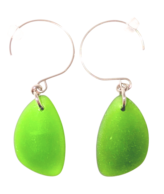 Green teardrop sea glass earrings with silver hooks.