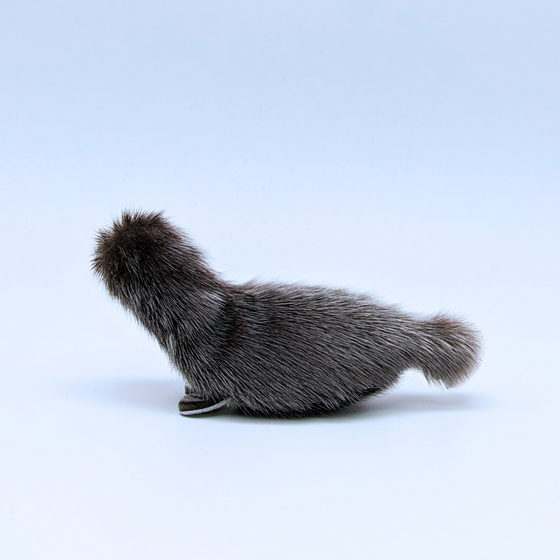 A fluffy grey seal hand made out of sealskin hide.