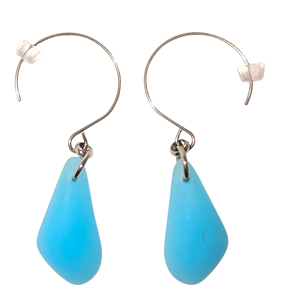 Turquoise teardrop sea glass earrings with silver hooks.
