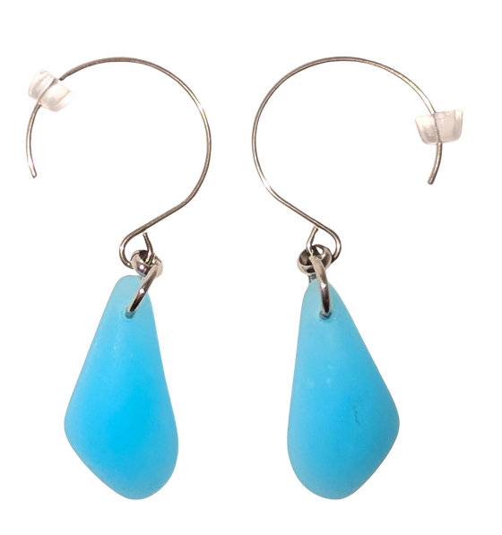 Turquoise teardrop sea glass earrings with silver hooks.