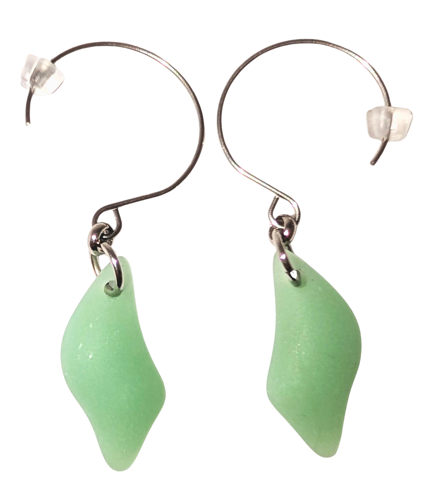 Green diamond-shaped sea glass earrings with silver hooks.