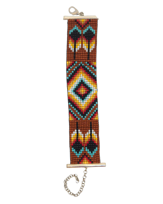First Nations beaded bracelet using brown, red, yellow, black, white and turquoise in geometric patterns. Adjustable length chain and lobster claw.
