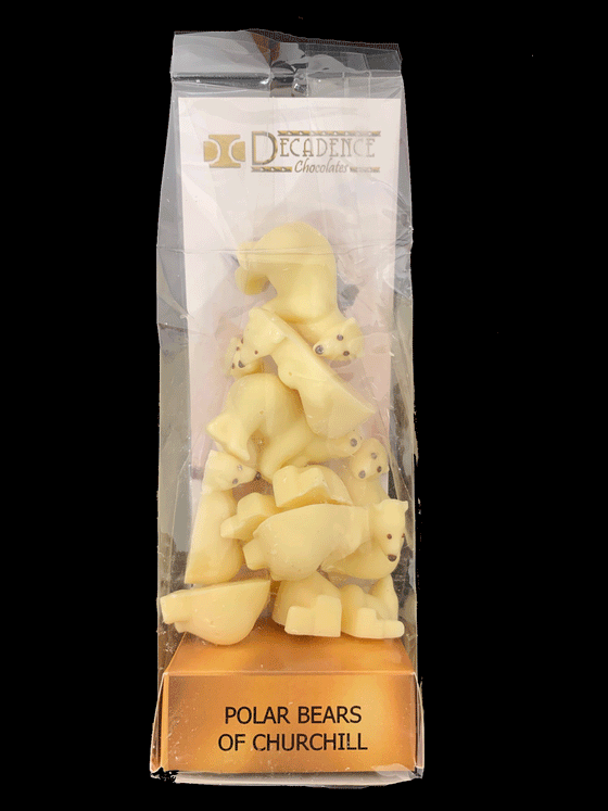 White chocolate shaped as polar bears. In plastic wrapping with cardboard backing that says "Polar Bears Of Churchill."
