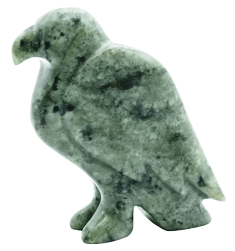 A beautiful, richly textured green stone eagle perches on two feet and looks to the left of frame.