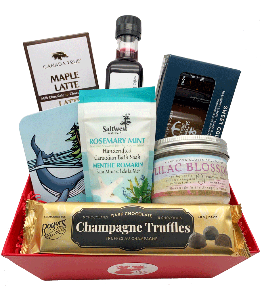 An enticing assorted Mother's Day Gift Basket, featuring made in Canada products including various jams, chocolates, champagne chocolate truffles, Partridgeberry vinaigrette, bath soak, and candle.