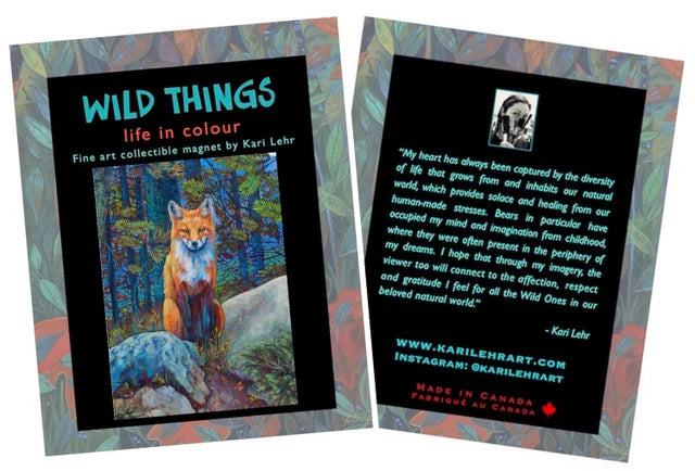 Magnet of Kari Lehr "A Wild Encounter" art print. Print image is fox on rocks. Magnet is on paper on with a colourful border and has "WILD THINGS" in blue on the front and a message from the artist on the back.