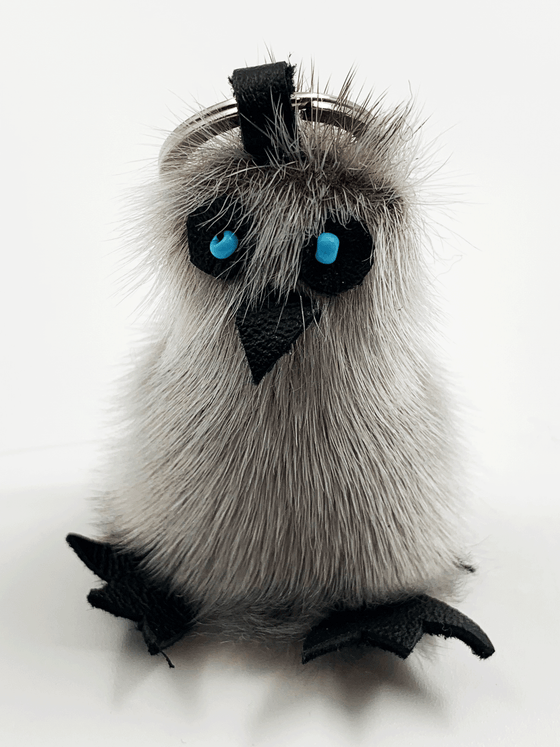 Sealskin owl-shaped key ring with turquoise beads for eyes.