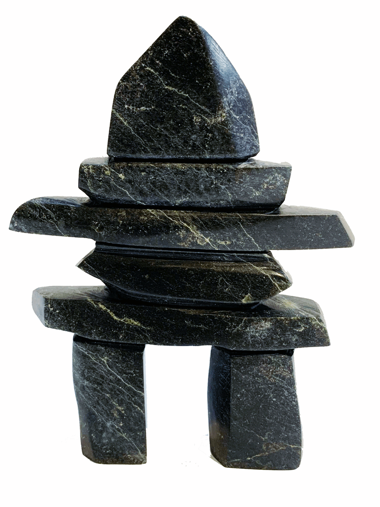 An inukshuk made of five slender slabs stacked on top of two broad legs and topped with a large head