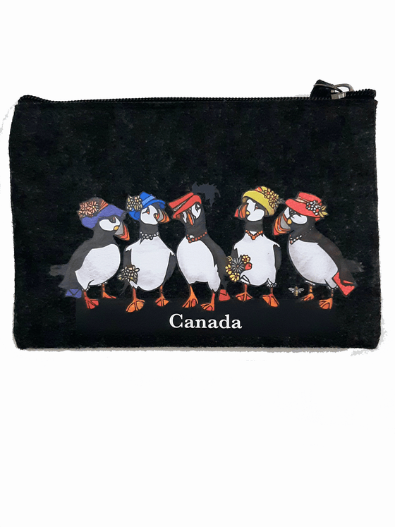 A charcoal felt pouch that features an art print of five puffins. Each puffin is wearing a fancy hat coloured either purple, blue, red, or yellow with flowers attached, while the middle puffin has a large black feather. Two puffins are holding small envelops, and two are holding bouquets. 