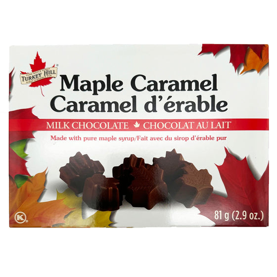 White box with maple leaves as border. Images of the maple leaf shaped chocolate in center of box.