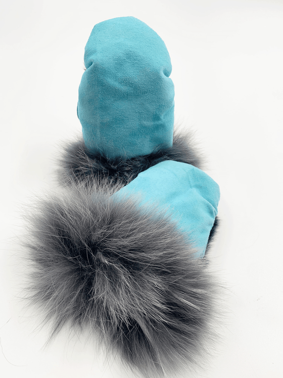 Dyed baby blue sealskin mittens with fluffy grey fur cuffs.
