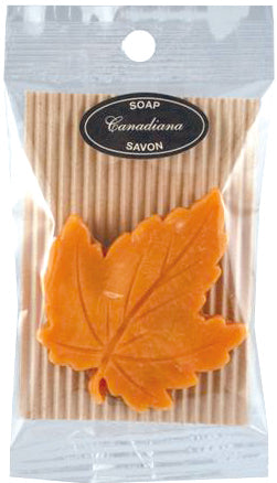 Yellow Gold Maple leaf shaped soap. Soap is inside a plastic transparent package, with a label reading 'Canadian Soap'.