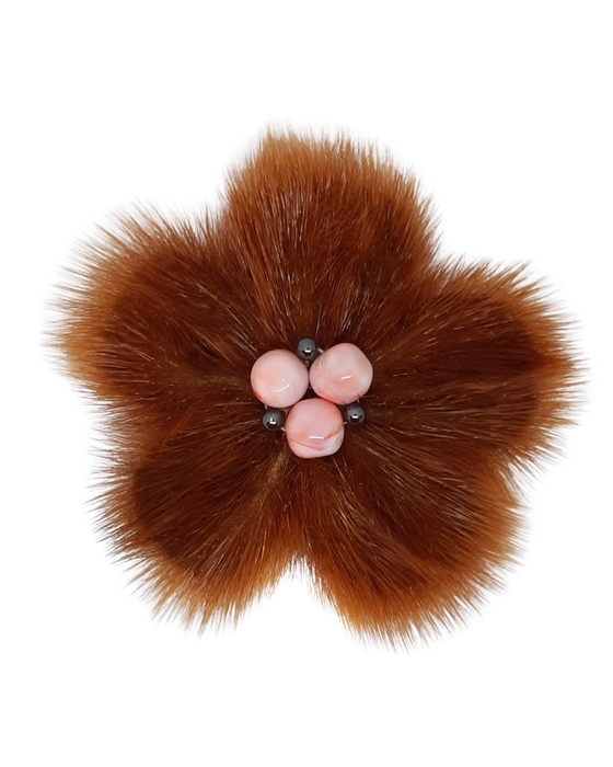 Flower-shaped brooch made of orange sealskin fur and leather with 3 large pink beads and 3 small grey beads in centre.