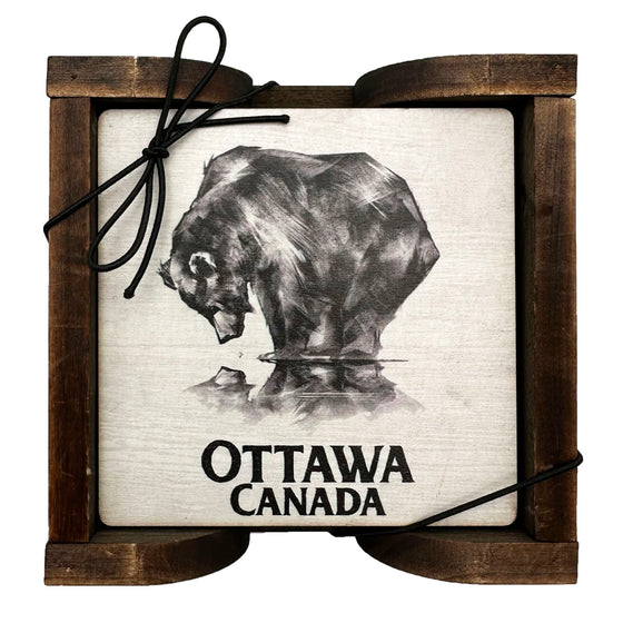Set of 4 Ottawa Reflecting Bear Coasters with a bear staring down at his reflection against a white background and the words" Ottawa, Canada" written on the bottom and comes with a wooden holder