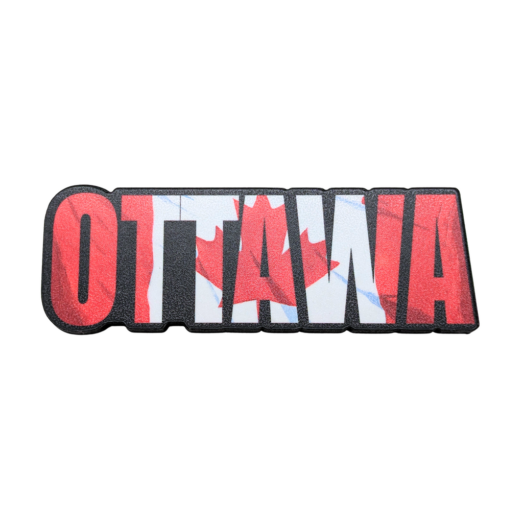 Wooden magnet of the word Ottawa with a Canadian flag in the background.