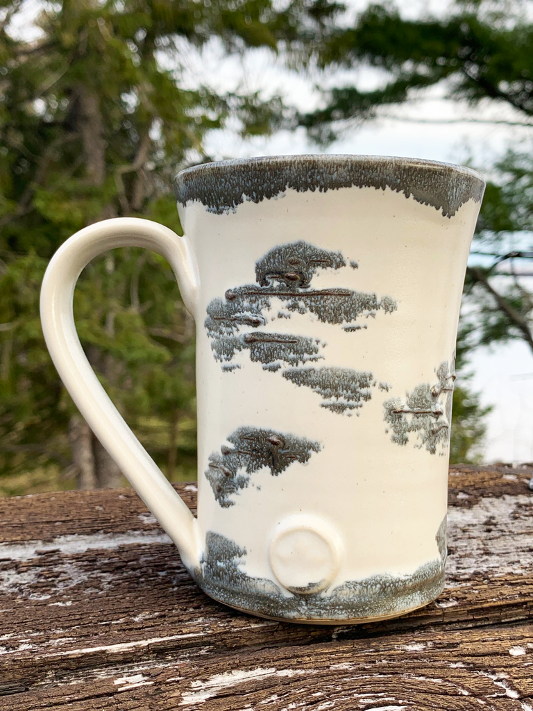 15 oz hand-thrown pottery mug with birch bark glaze and a maple leaf seal.