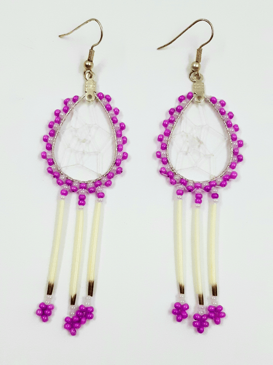 A pair of porcupine quill earrings. The hanging earrings are a tear drop shape hoop with dream catcher style weaving on the inside. Purple and white beads are woven along the outside of the hoop and hanging off of the bottom are three strands with purple and white beads, then a piece of porcupine quill, with more white and purple beads at the end.