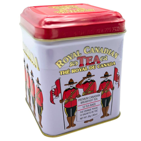 A small white and red metal tin that holds twelve bags of black tea. Several RCMP in red uniforms saluting and holding Canadian flags are pictured around the tin. The gold writing on the tin gives a three dimensional element as the words are raised from the flat surface. The lid has a small hinge on one side, allowing the container to be resealed. The tea is blended and packaged in Canada. It includes instructions to brew for three to five minutes, can be served hot or chilled.