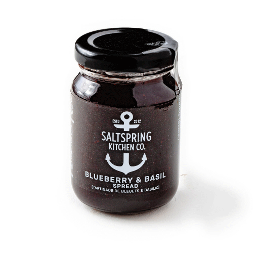 Canadian made blueberry and basil spread in a clear jar with black lid.