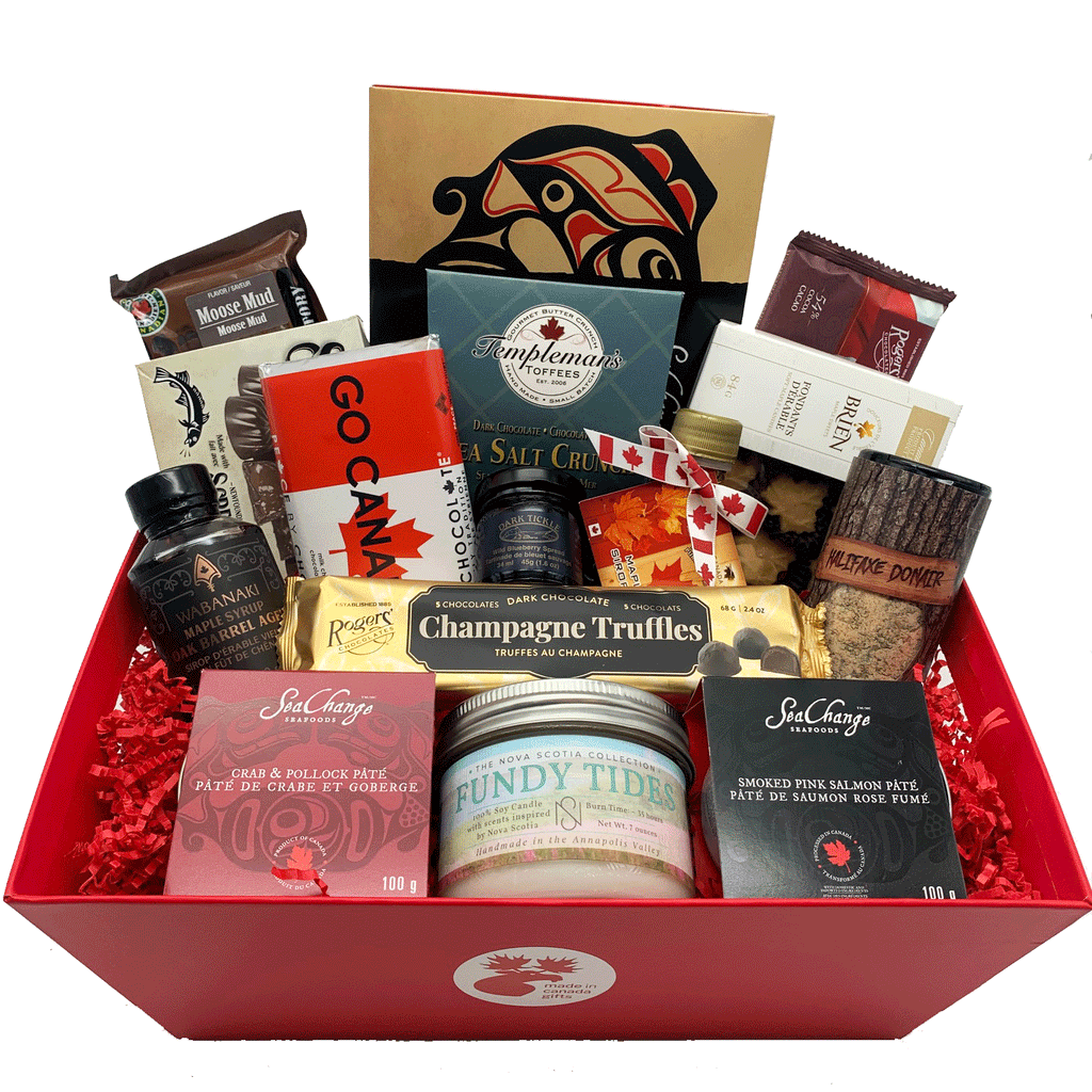 A jumbo assorted Sea to Sea gift basket featuring products made all across Canada. Products include smoked salmon, smoked salmon pâté, lobster and pollock pâté, chocolates, toffee, maple syrup, candies, jam, spice mix, and a candle. 