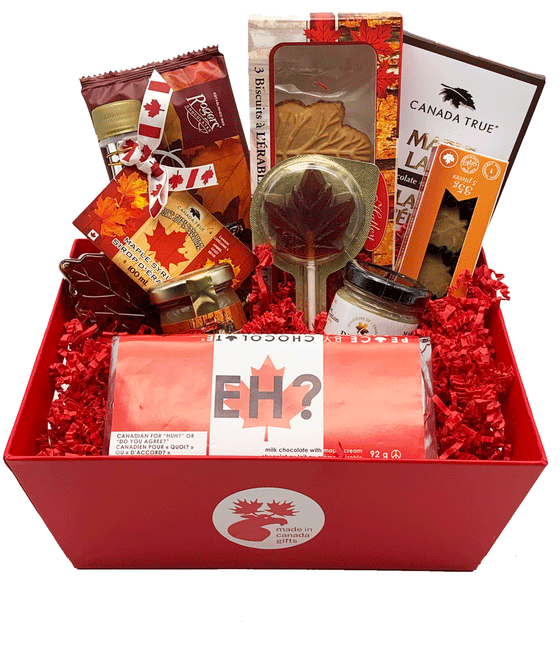 A small sized maple treats gift basket, featuring delicious made in Canada maple food products such as chocolates, cookies, butter, syrup, and candies.