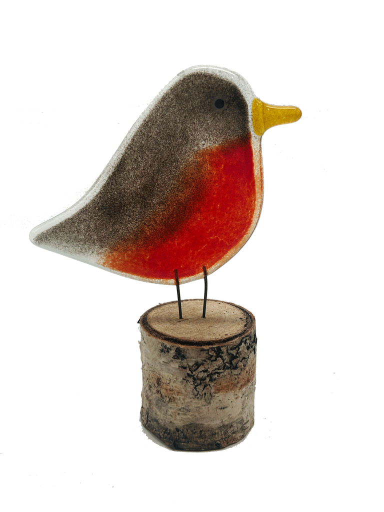 2-D Robin. Has yellow beak and a black and red body. Has 2 small metal rods coming from the bottom of it that look like legs. The metal rods are attached to a piece of a tree that looks like a small tree stump. The background is white.