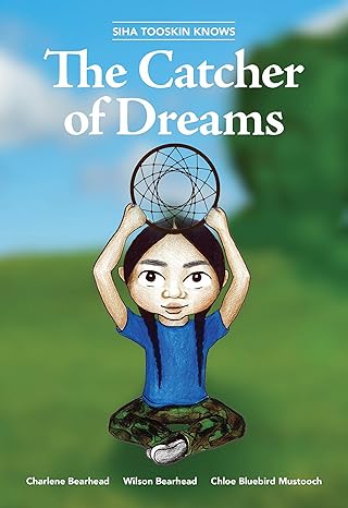 A smiling boy sits cross-legged, wearing a blue shirt, camo pants, and black and white running shoes. He holds a dreamcatcher over his head. Above the boy, the title of the book reads "The Catcher of Dreams."