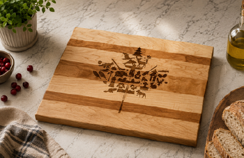 Canadian wooden serving board with engraved maple leaf and Canadian wildlife and landscape imagery, made in Ontario, Canada.