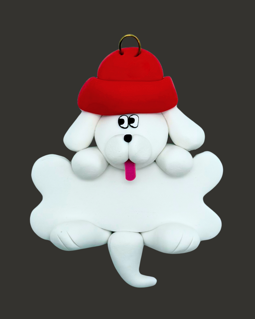 White dog ornament with a bone wearing a red hat on a black background.