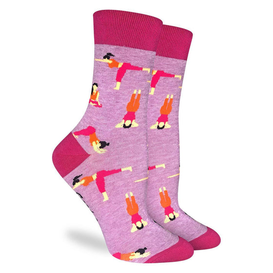 These fun socks feature women is yoga poses such as downward dog, lotus pose, and warrior III on a pink background with a hot pink toe, heel, and rim. Spandex added to the 85% cotton blend gives the socks the perfect amount of stretch to hug your feet.