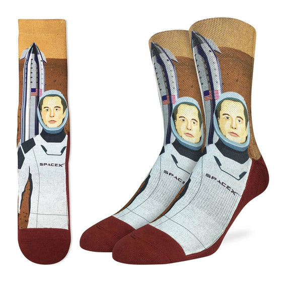These socks are ready top be shipped off to Mars. With a design featuring Elon musk in his SpaceX suit and a rocket ship adorned with the American flag.  48% Polyester, 45% Cotton, 5% Elastic, 2% Spandex