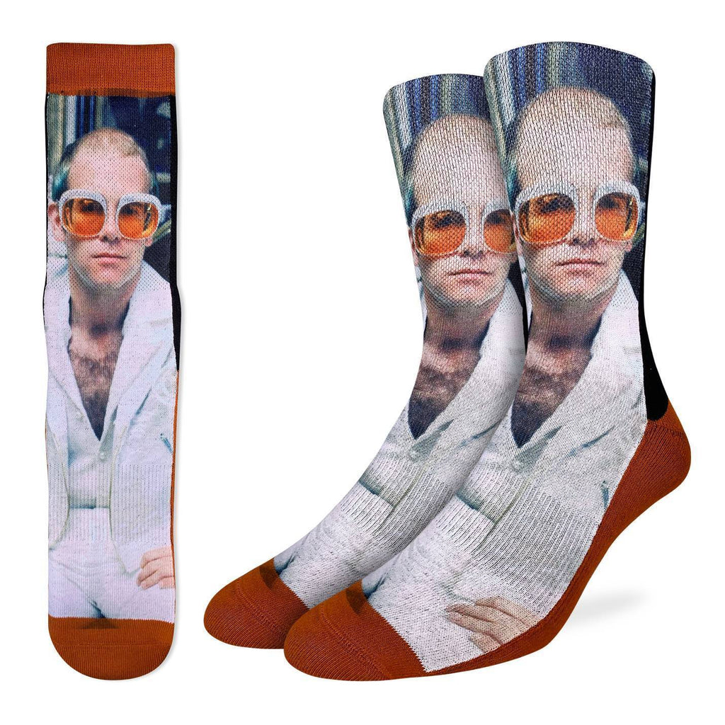 The man, the myth, the legend.  These socks feature a close up of Sir Elton John in his famous white jacket and orange sunglasses. 48% Polyester, 45% Cotton, 5% Elastic, 2% Spandex