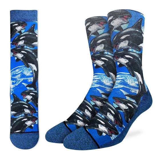 These active fit socks feature a print with several orca whales. These majestic sea creatures can now decorate your feet whether you're on or off the land. They are dark blue at the cuff and from the heel through the sole to the toe. The body of the sock is a lighter blue with the whales swimming around  48% Polyester, 45% Cotton, 5% Elastic, 2% Spandex