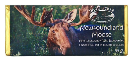 Small chocolate bar wrapped in gold foil. In a sleeve with photo of a Newfoundland Moose in tall grass.