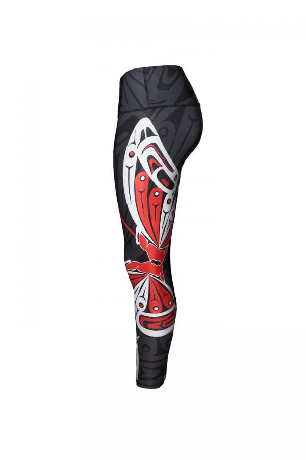 The butterfly leggings viewed from the left. This angle provides a full view of a butterfly. Its large wings are largely white with red details. The butterfly’s body looks like two faces touching noses. The symmetry and closeness feels sweet and balance.