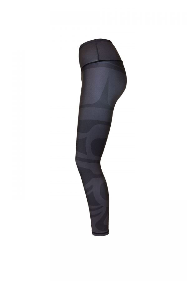 The eagle maple leaf leggings viewed from the left. Only the subtle grey lines of the larger motif can be seen.