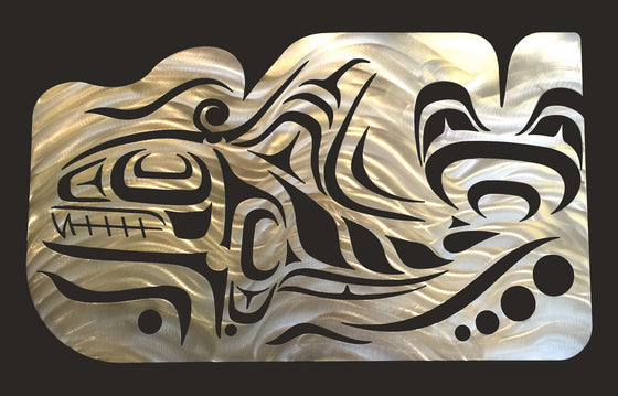 A Coastal Salish wall sculpture on a black background. Crescents, u-shapes and trigons carved out of a brushed metal sheet create the form of an imposing Orca whale with a tall dorsal fin and strong tail. The top edge of the metal sheet has also been carved to create the impression of water moving in response to the powerful motion of the whale.