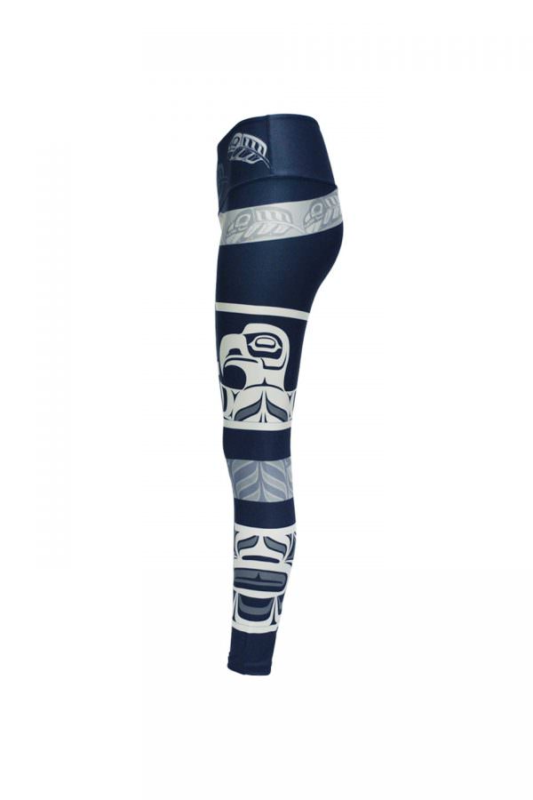 The intelligence leggings viewed from the left. This angle provides a clearer view of the white eagle on the left leg, as well as a white and grey feather pattern on the hip.